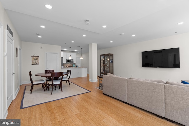 dining room with light hardwood / wood-style floors