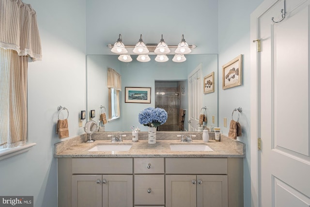 bathroom featuring vanity and an enclosed shower