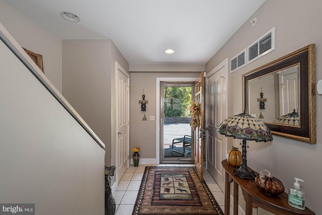 entryway featuring light tile patterned flooring