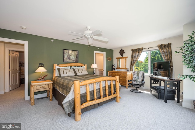 bedroom featuring ceiling fan and carpet