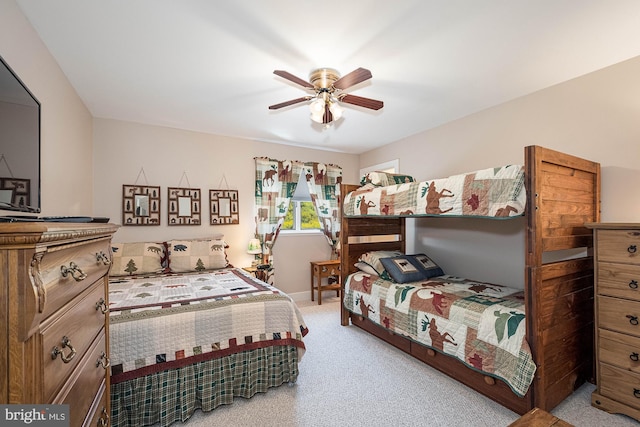 bedroom featuring light carpet and ceiling fan