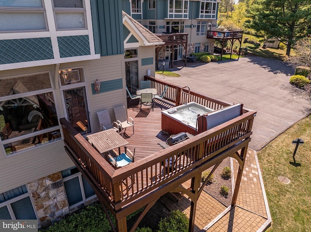 wooden terrace with a patio