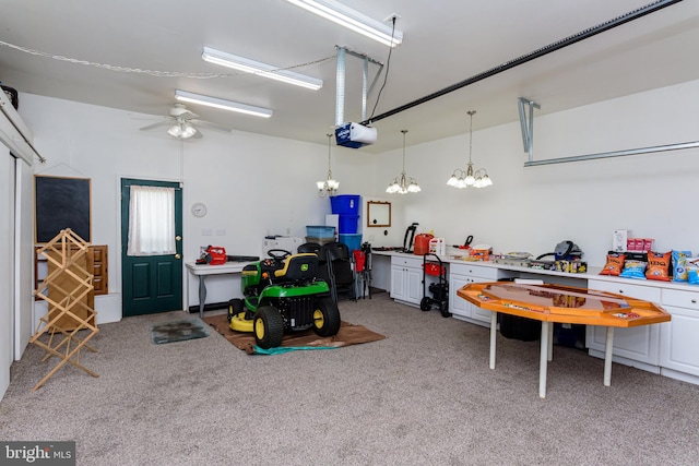 garage with a garage door opener and ceiling fan