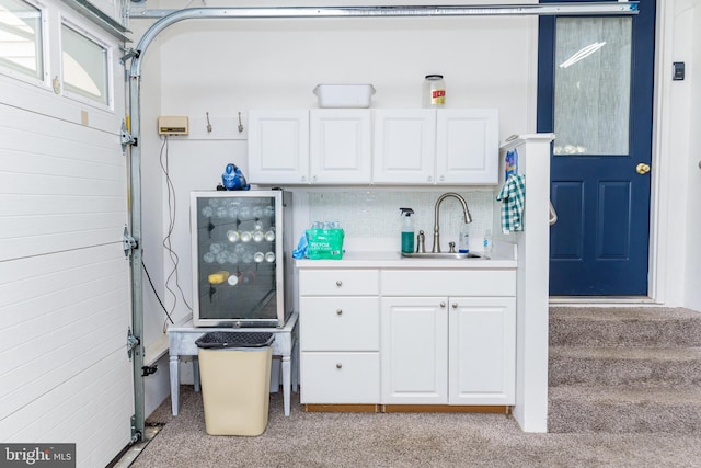 interior space with light colored carpet and sink