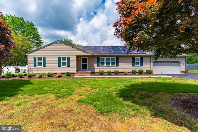 ranch-style house with a front yard and a garage