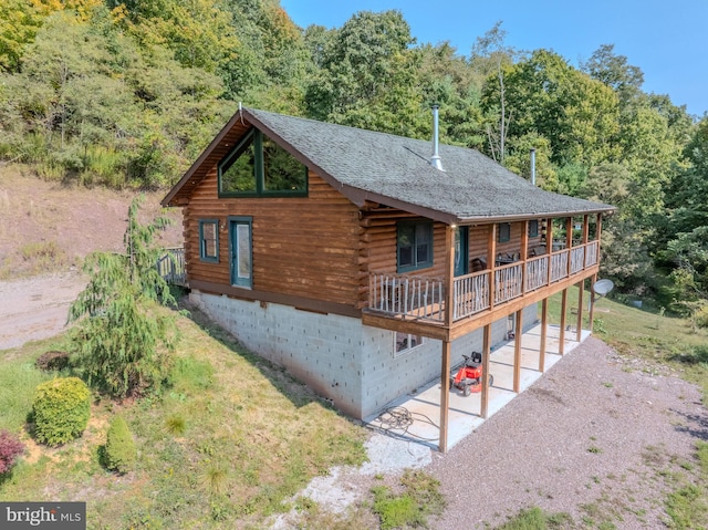 view of property exterior featuring covered porch