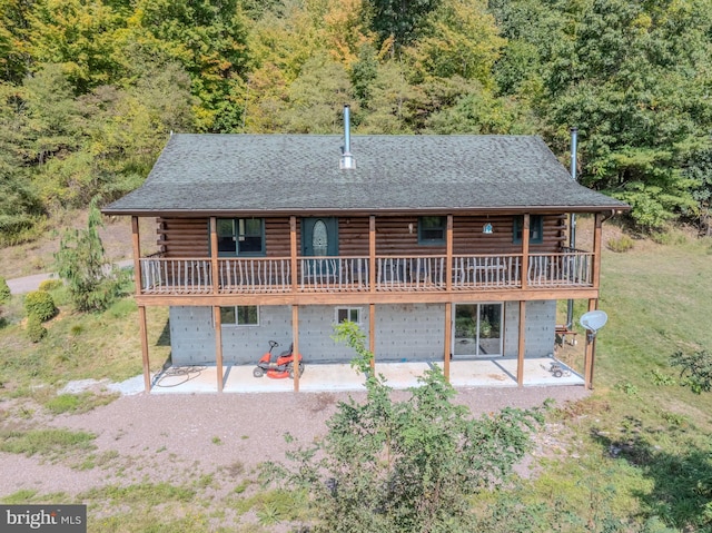 back of property with a patio