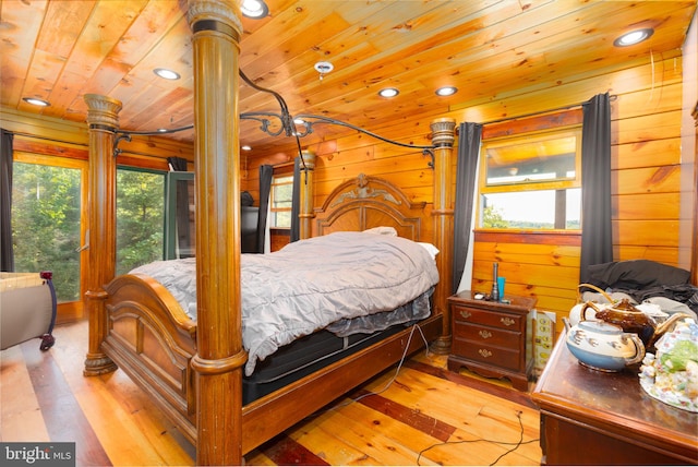 bedroom featuring wood walls, recessed lighting, wood ceiling, and wood-type flooring