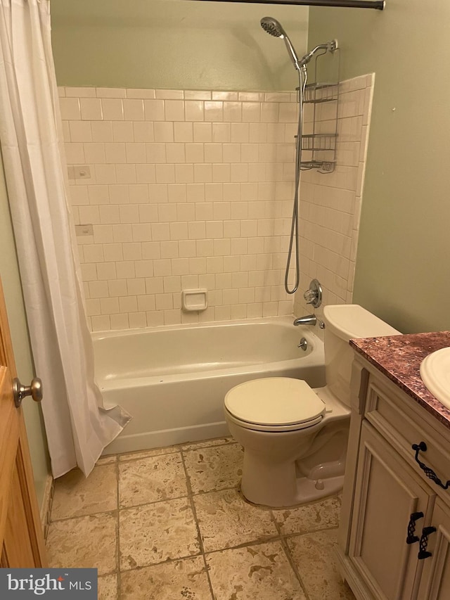 full bathroom featuring shower / bath combination with curtain, vanity, and toilet