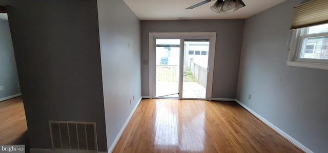 unfurnished room featuring ceiling fan and light wood-type flooring