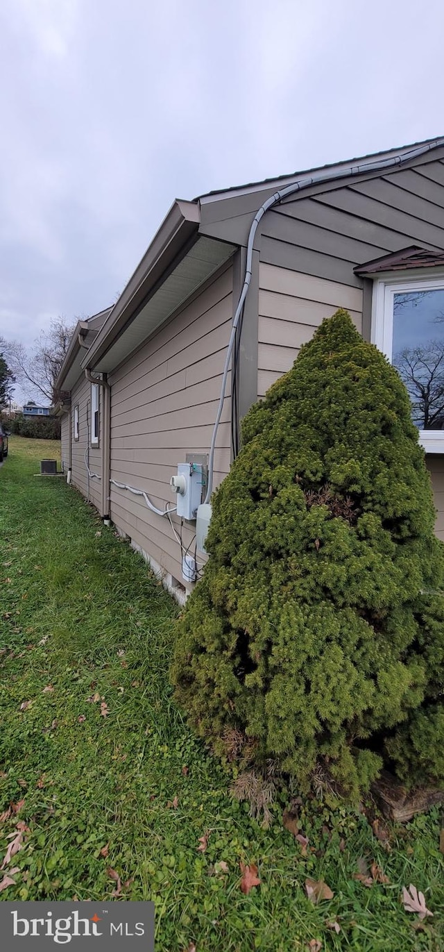 view of home's exterior featuring a yard