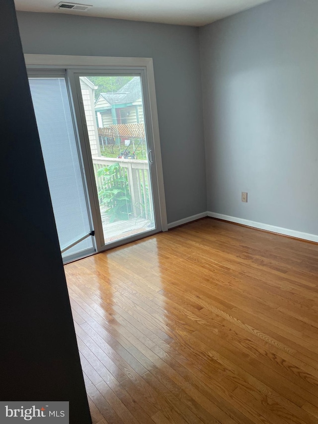 spare room with light wood-type flooring