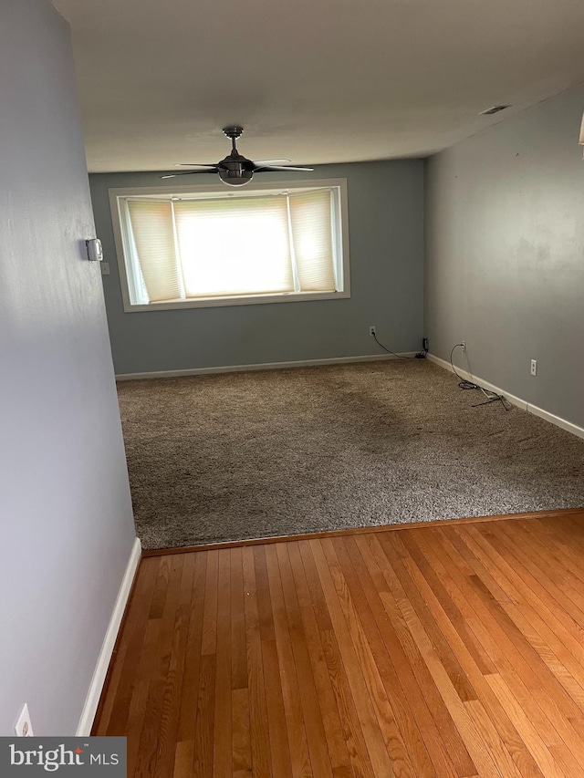 unfurnished room featuring ceiling fan and wood-type flooring