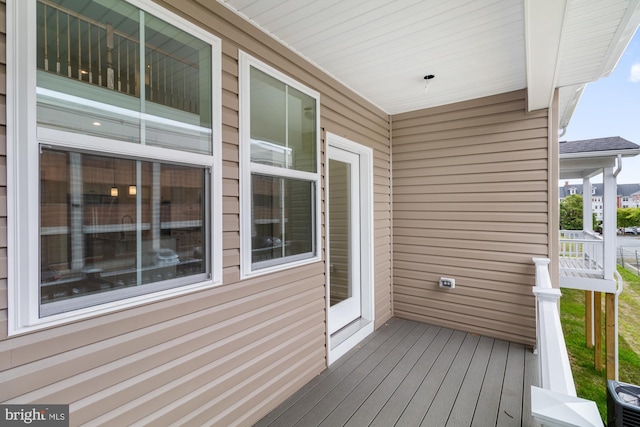 wooden terrace with a porch