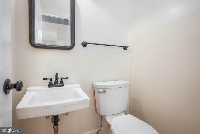 bathroom featuring sink and toilet