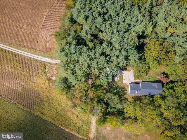 birds eye view of property with a rural view