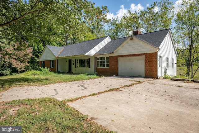 ranch-style house featuring a garage