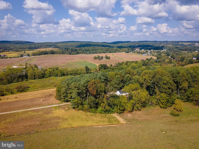 birds eye view of property with a rural view