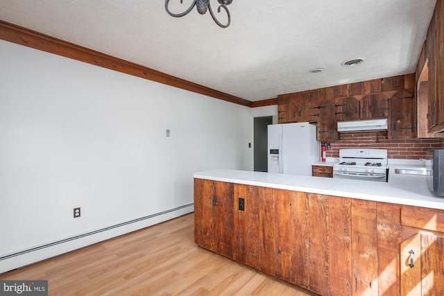 kitchen with kitchen peninsula, white appliances, light hardwood / wood-style flooring, a baseboard heating unit, and crown molding