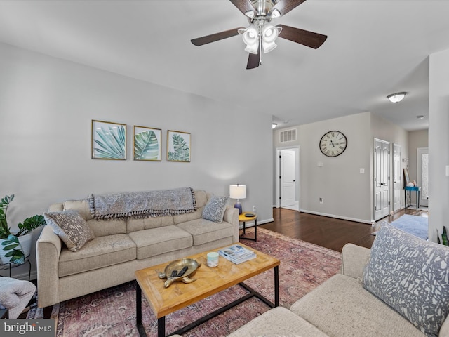 living room featuring ceiling fan and hardwood / wood-style floors