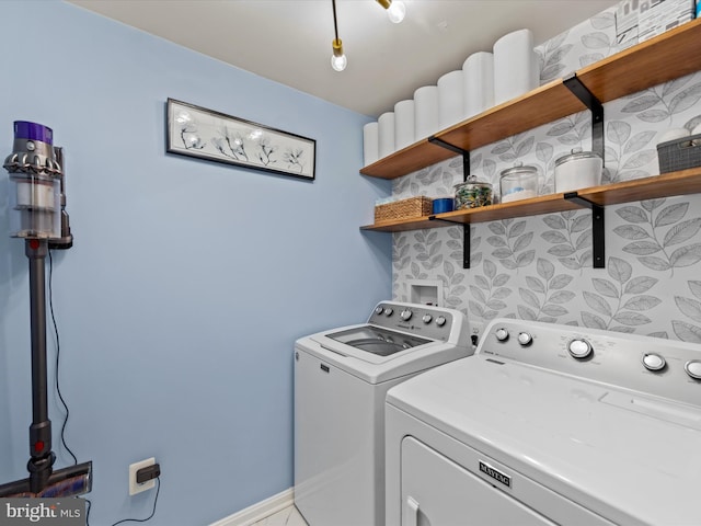 washroom featuring washer and clothes dryer