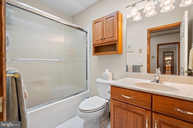 full bathroom with shower / bath combination with glass door, vanity, and toilet