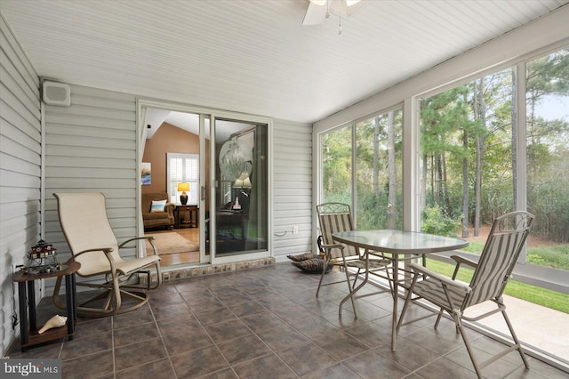 sunroom featuring ceiling fan