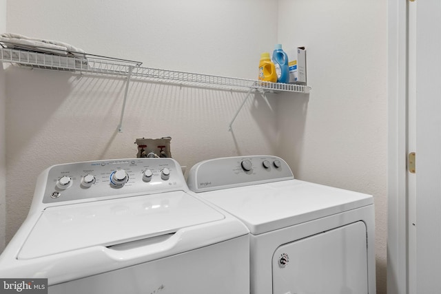 clothes washing area featuring washing machine and dryer