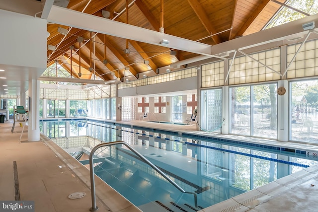 view of swimming pool with an indoor hot tub