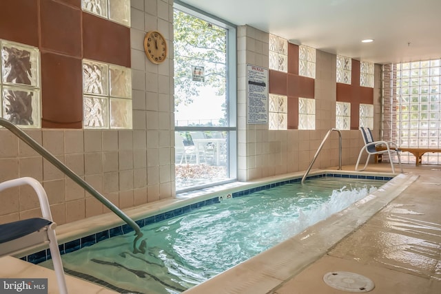 view of pool with an indoor in ground hot tub