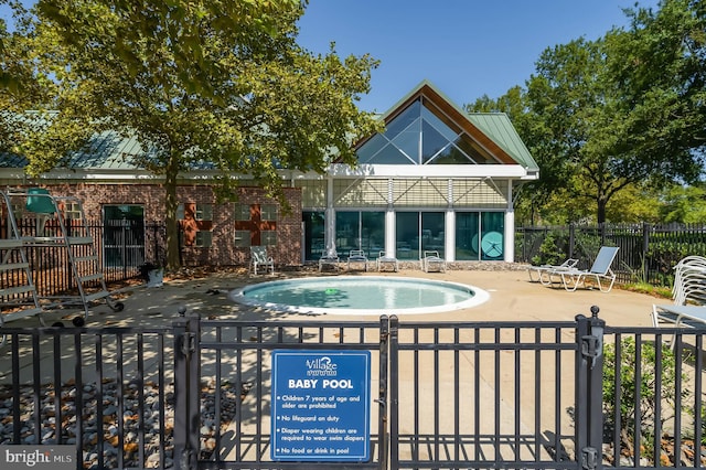 view of pool with a patio and a jacuzzi