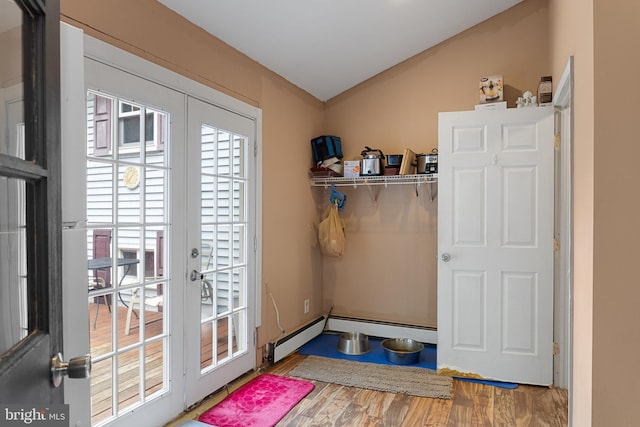 interior space with french doors, hardwood / wood-style flooring, and vaulted ceiling