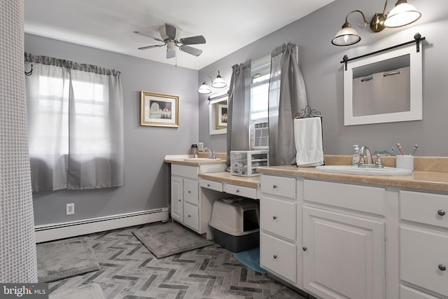 bathroom with vanity, a baseboard radiator, and ceiling fan