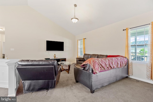 carpeted bedroom with lofted ceiling