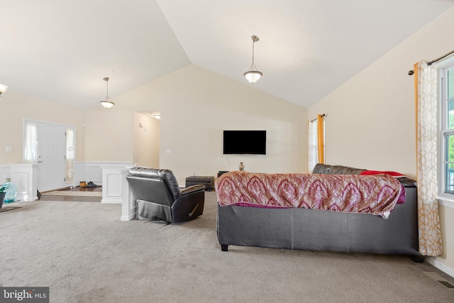 carpeted living room featuring lofted ceiling