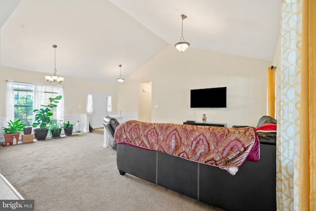 living room featuring lofted ceiling, carpet, and a notable chandelier