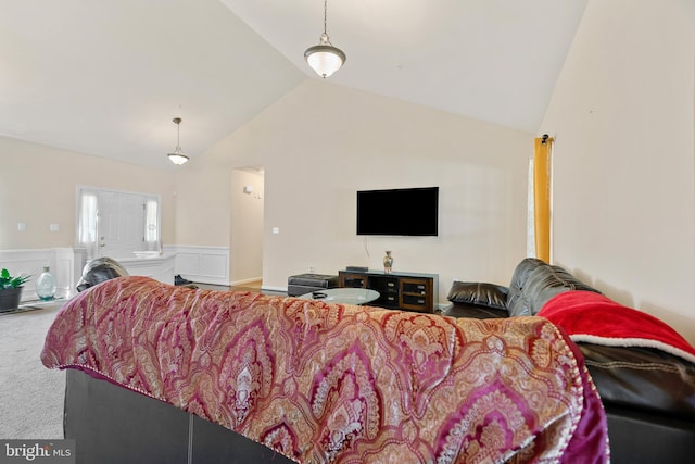 living room featuring carpet flooring and vaulted ceiling