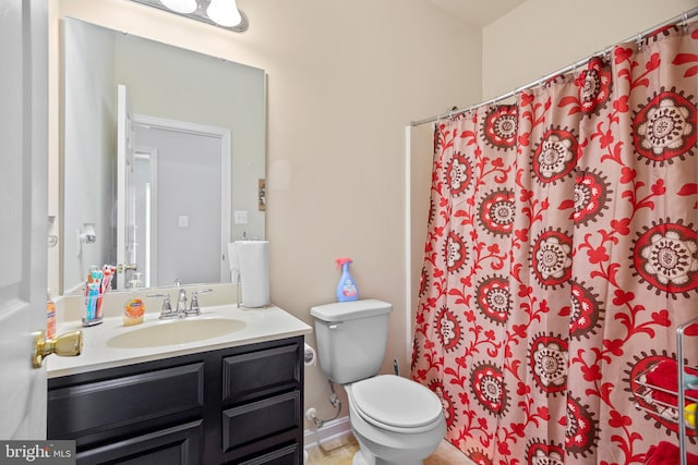 bathroom with walk in shower, toilet, and vanity