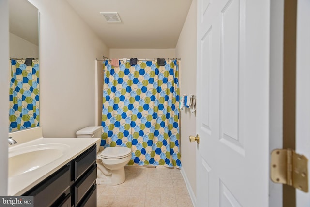 bathroom with vanity, toilet, curtained shower, and tile patterned flooring