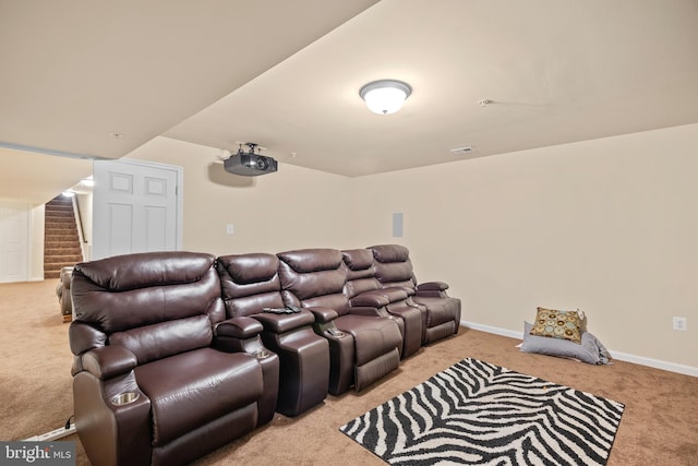 home theater room featuring light carpet