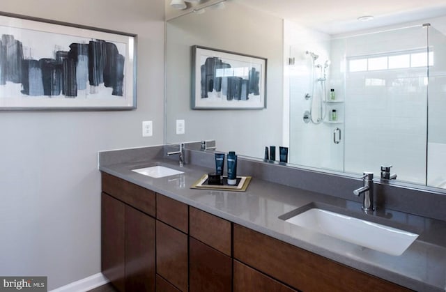 bathroom with vanity and an enclosed shower