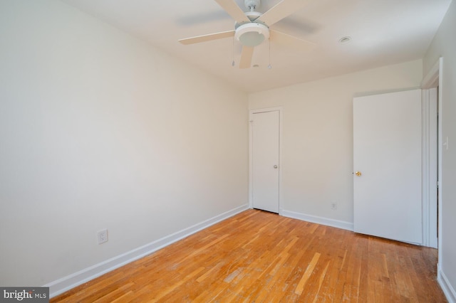 unfurnished room featuring light hardwood / wood-style floors and ceiling fan