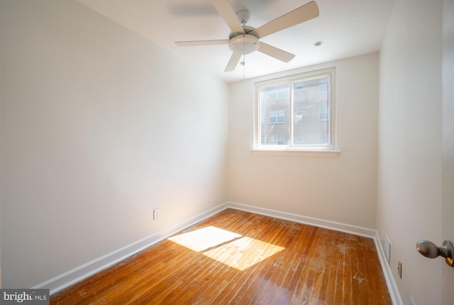 unfurnished room with wood-type flooring and ceiling fan