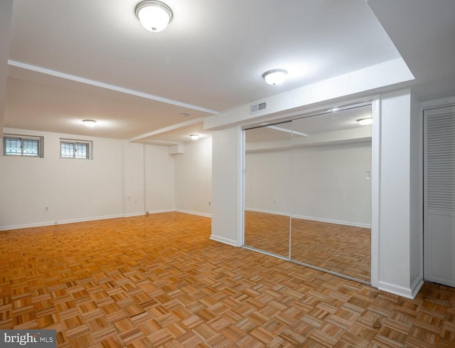 basement with light parquet floors