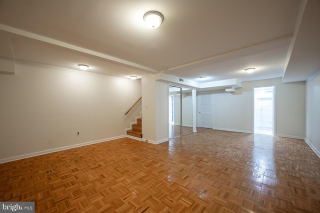 basement featuring parquet floors