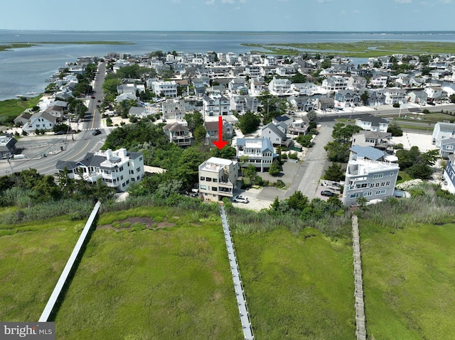 aerial view with a residential view and a water view