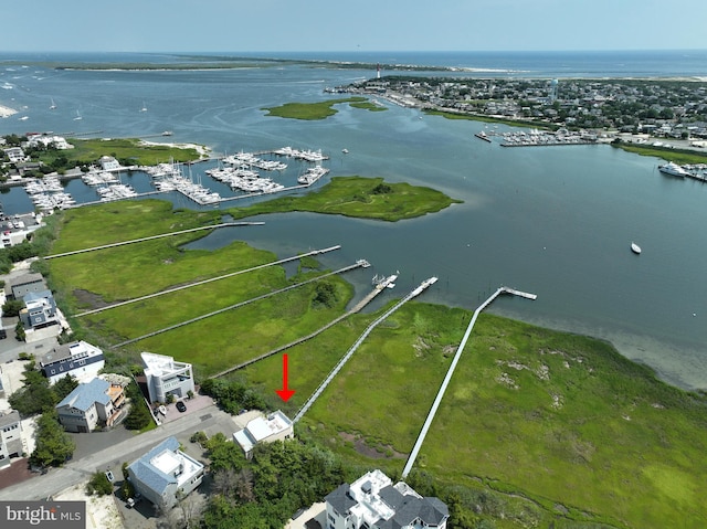 birds eye view of property featuring a water view