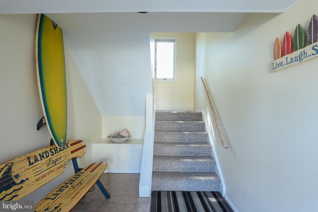 staircase with tile patterned floors