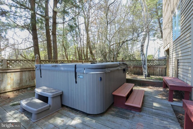 deck with a hot tub