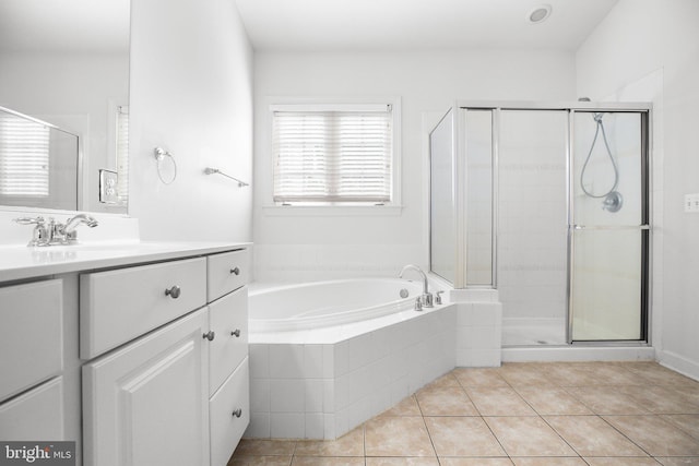 bathroom featuring tile patterned floors, vanity, and separate shower and tub